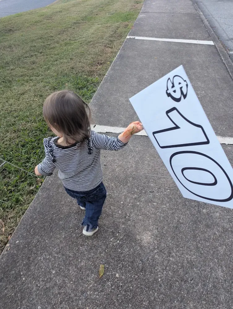 customer photos of yard sign plus