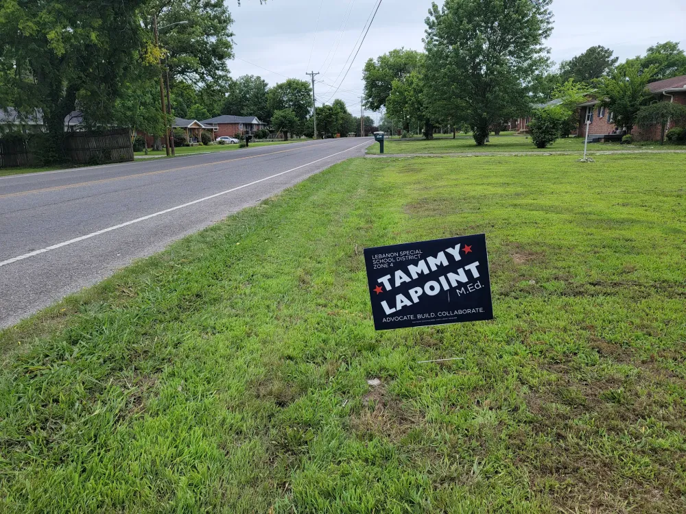 customer photos of yard sign plus